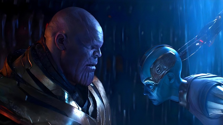Thanos looking at a restrained Nebula