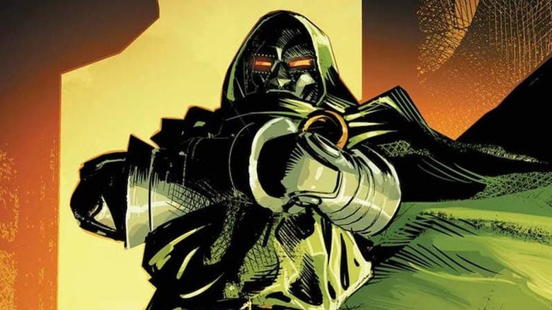 Doctor Doom stands with his arms folded
