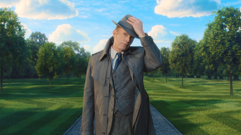 Vision in human form wearing a suit, coat, and hat on VisionQuest