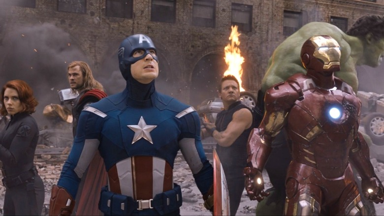 The Avengers standing in circle