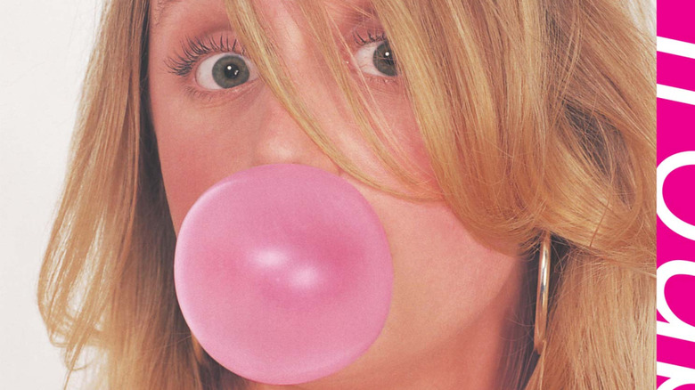 Girl blowing gum bubble