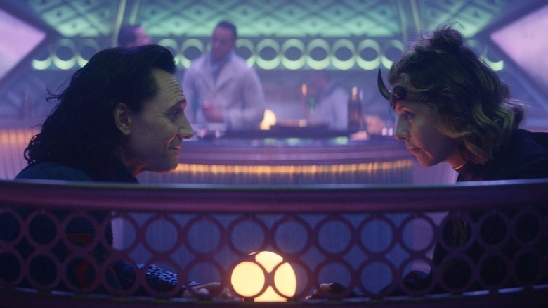 Loki and Sylvie speak at a bar