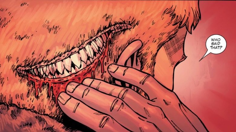 Johnny Blaze touching the demon parasite in Ghost Rider