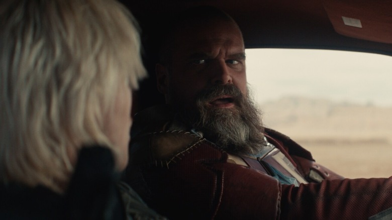 Red Guardian drives a limo and talks to Yelena in 