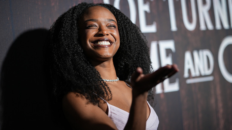 Maya Boyd blowing a kiss on a red carpet