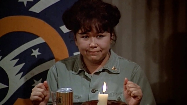 Nurse Kellye lights candle on "M*A*S*H"