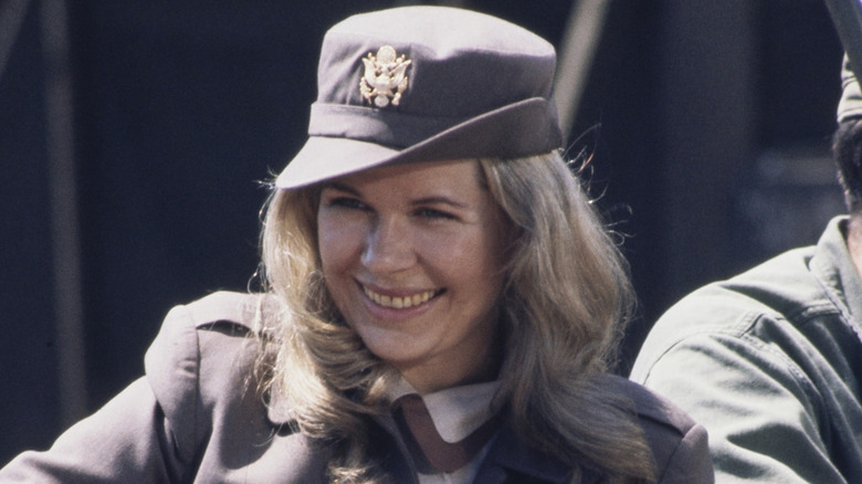 Margaret J. "Hot Lips" Houlihan smiles in a jeep in "M*A*S*H"