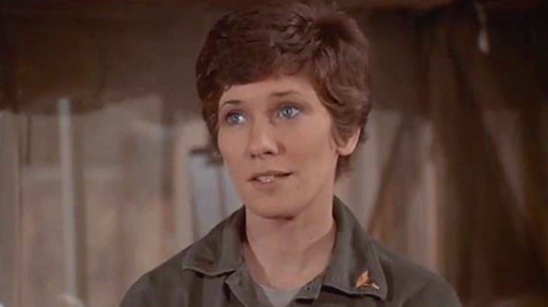 Nurse Baker gazes at something on "M*A*S*H"