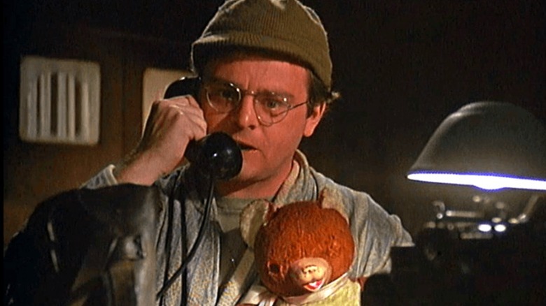 Radar and his teddy bear on the phone