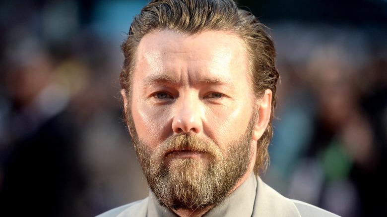 Joel Edgerton posing at event