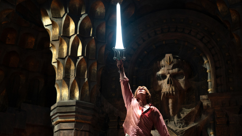 Prince Adam holds his sword aloft in "Masters of the Universe" (2026)