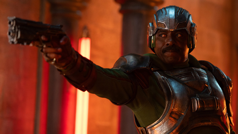 Man At Arms points his gun in "Masters of the Universe" (2026)