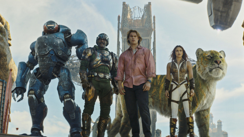 Roboto, Man-at-Arms, Adam, Teela, and Cringer stand together in "Masters of the Universe" (2026)
