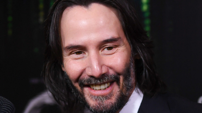 Keanu Reeves smiles