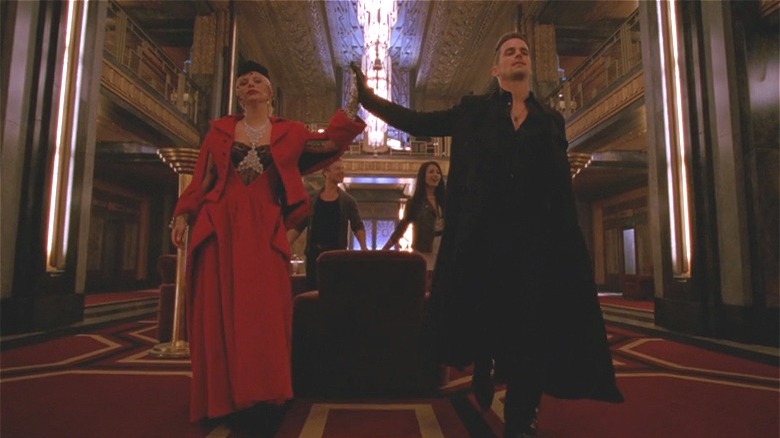 The Countess and Donovan touching hands 