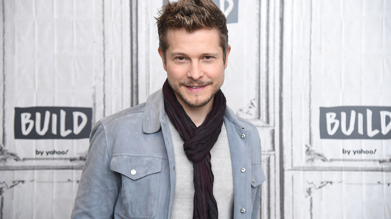 Matt Czuchry wears a scarf