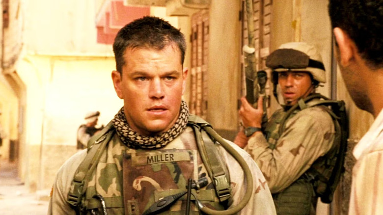 Roy Miller talks to an Iraqi citizen on the street in "Green Zone" (2010)