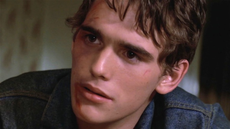 Matt Dillon looking bruised in The Outsiders 