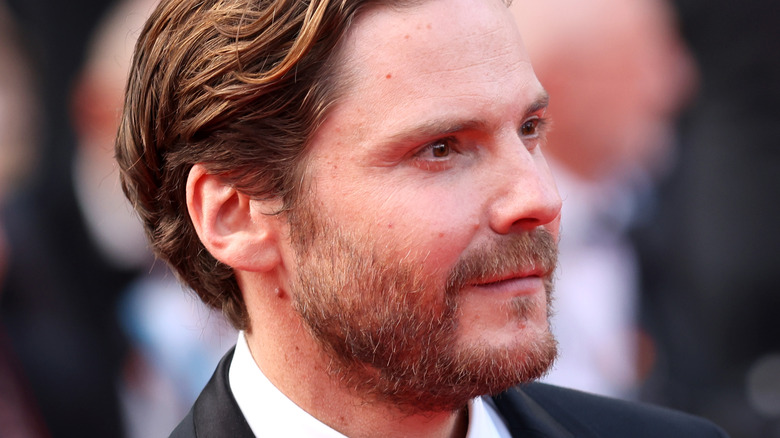 Daniel Brühl looking to side