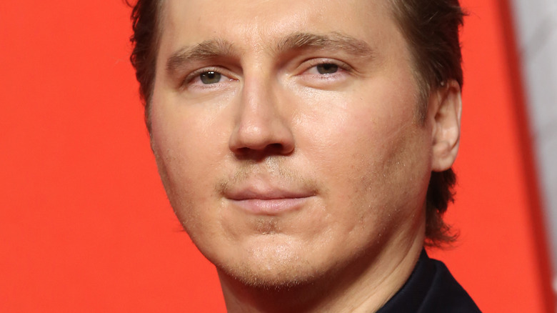 Paul Dano slightly smiling