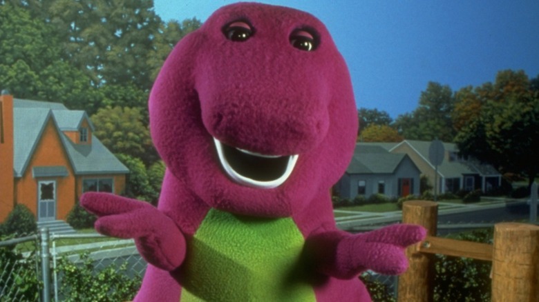 Barney standing in a neighborhood
