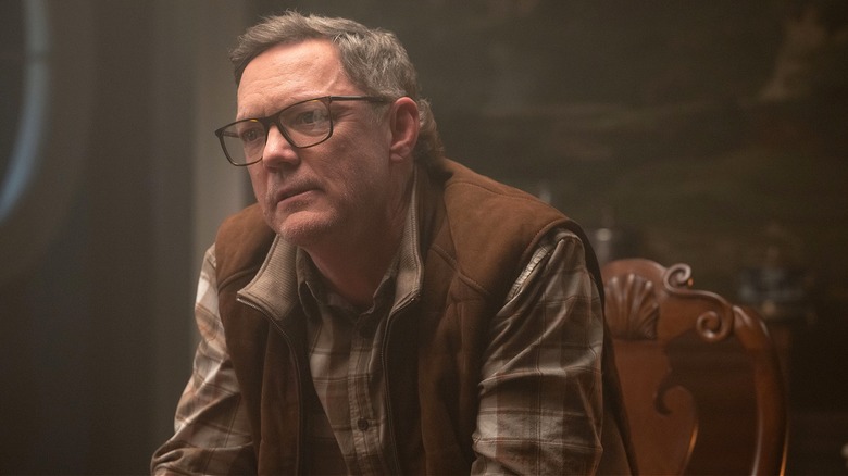 Mr. Charles leaning forward in chair in "Daredevil: Born ﻿Again" ﻿Season 2