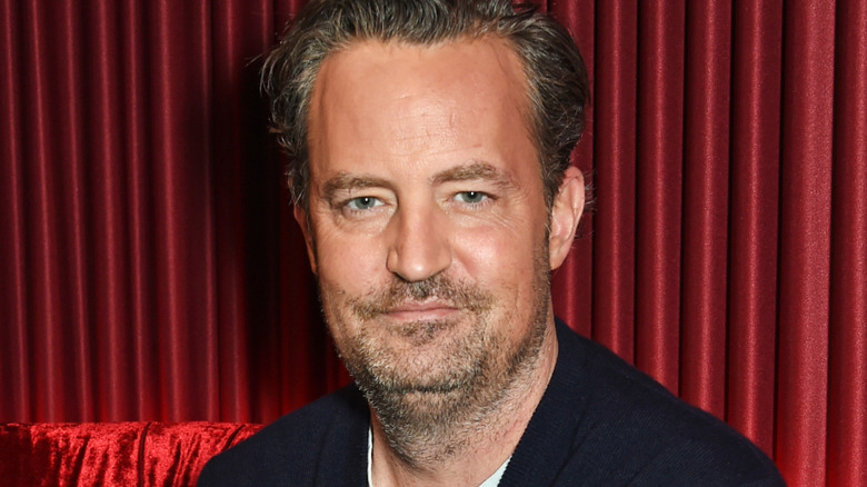 Matthew Perry smirking