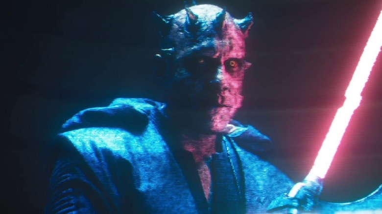 A hologram of Maul holding a lightsaber in Solo: A Star Wars Story (2018)