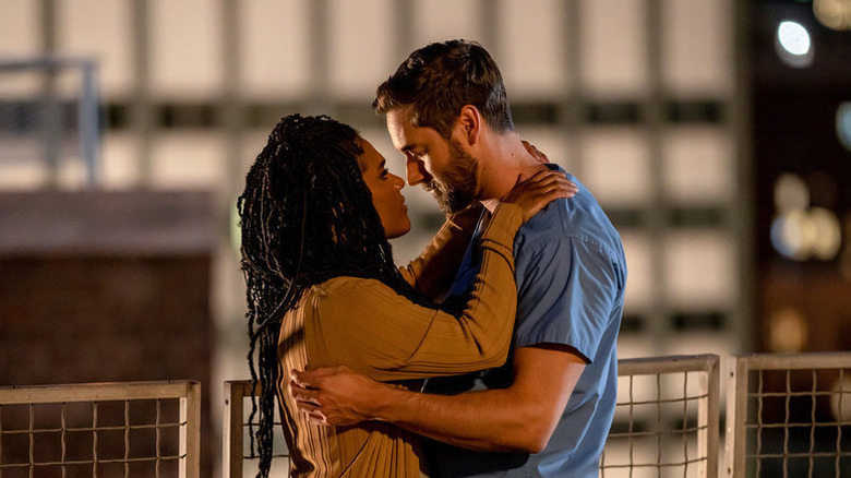 Max and Helen embrace