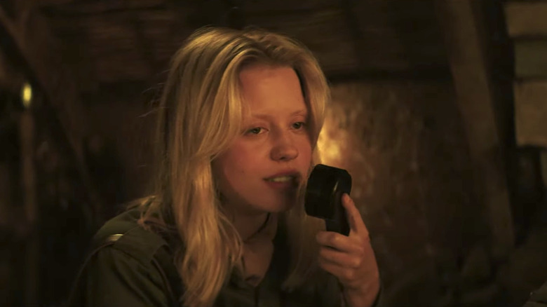 Marsha holding radio in Mayday