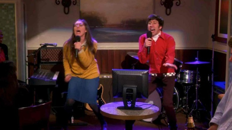 Amy and Howard singing karaoke
