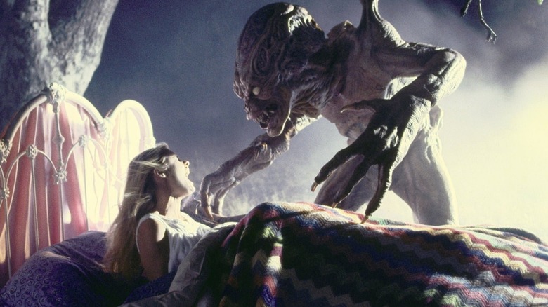 Pumpkinhead looming over a screaming child in "Pumpkinhead II: Blood Wings" (1993)