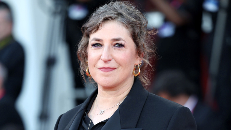 Mayim Bialik smiling on the red carpet in 2025