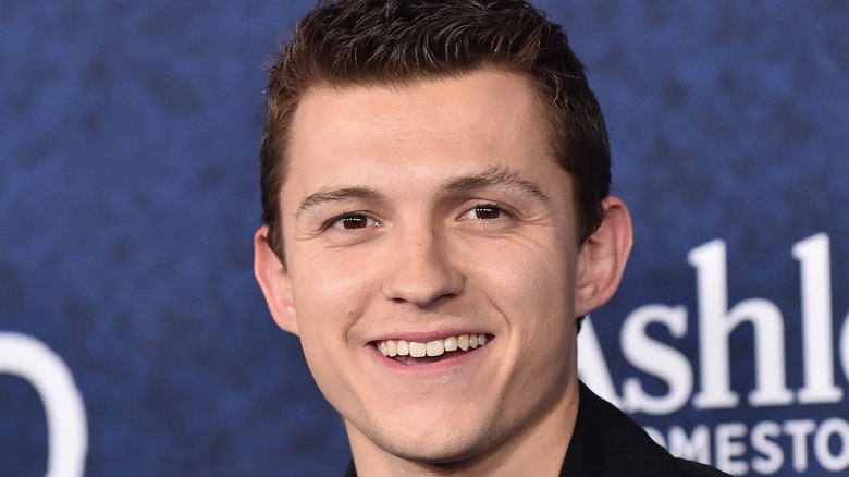 Tom Holland smiling with eye wrinkles