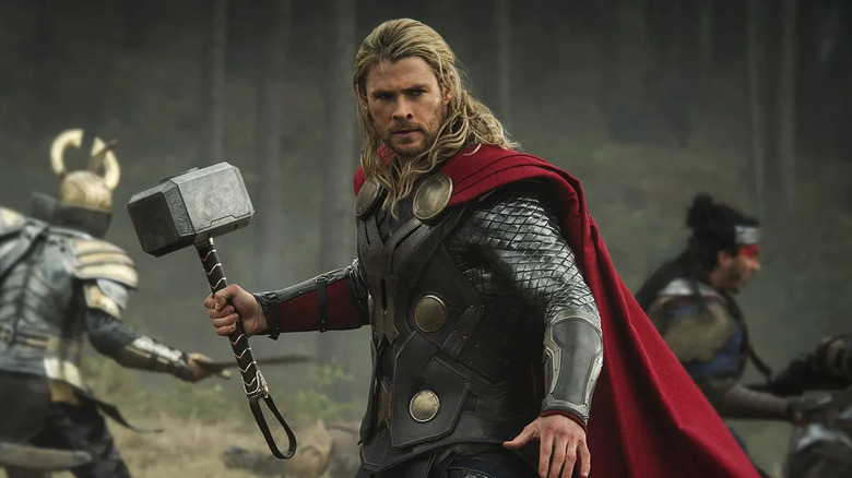 Thor stands ready on the battlefield in "Thor: The Dark World" (2013)