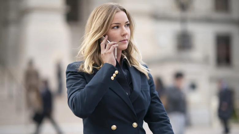 Sharon Carter talks on a cell phone in the street in Falcon and the Winter Soldier