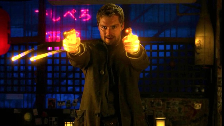 Iron Fist aims two glowing guns in Iron Fist