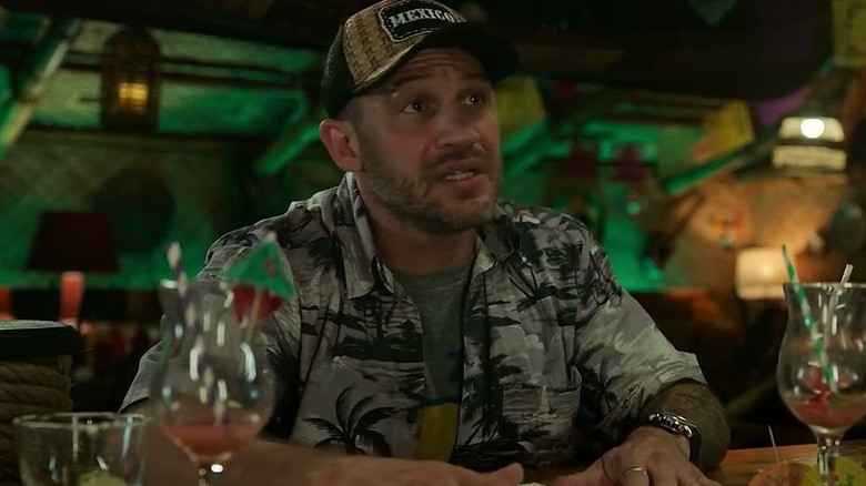 Eddie Brock sits at the bar in Venom: The Last Dance.