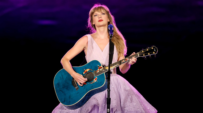 Taylor Swift playing guitar