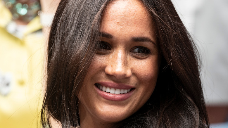 Meghan Markle smiles