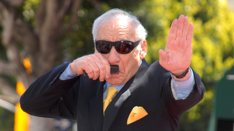 Mel Brooks doing mock salute