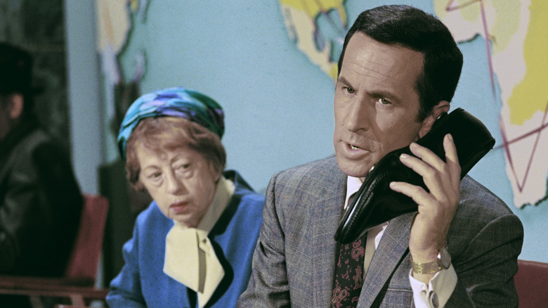 Maxwell Smart talks into shoe