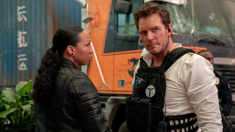 Chris Raven and Jaq Diallo looking around at crime scene