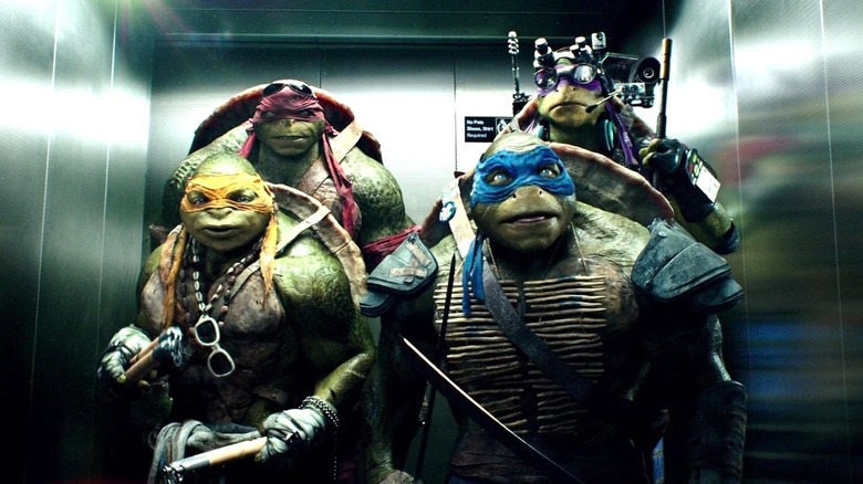 Michelangelo, Raphael, Leonardo, and Donatello going up in an elevator in 