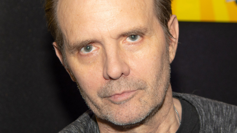 Michael Biehn looks at camera