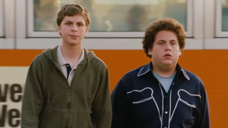 Michael Cera and Jonah Hill walk away from a bus