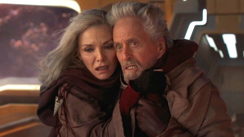 Hank Pym and Janet van Dyne embracing and looking scared