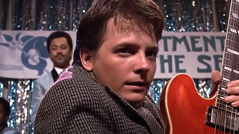 Marty McFly playing guitar on stage in Back to the Future (1985)