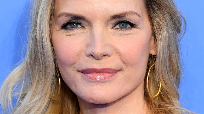 Michelle Pfeiffer wearing gold loop earings