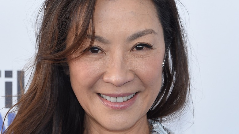 Michelle Yeoh simling into camera